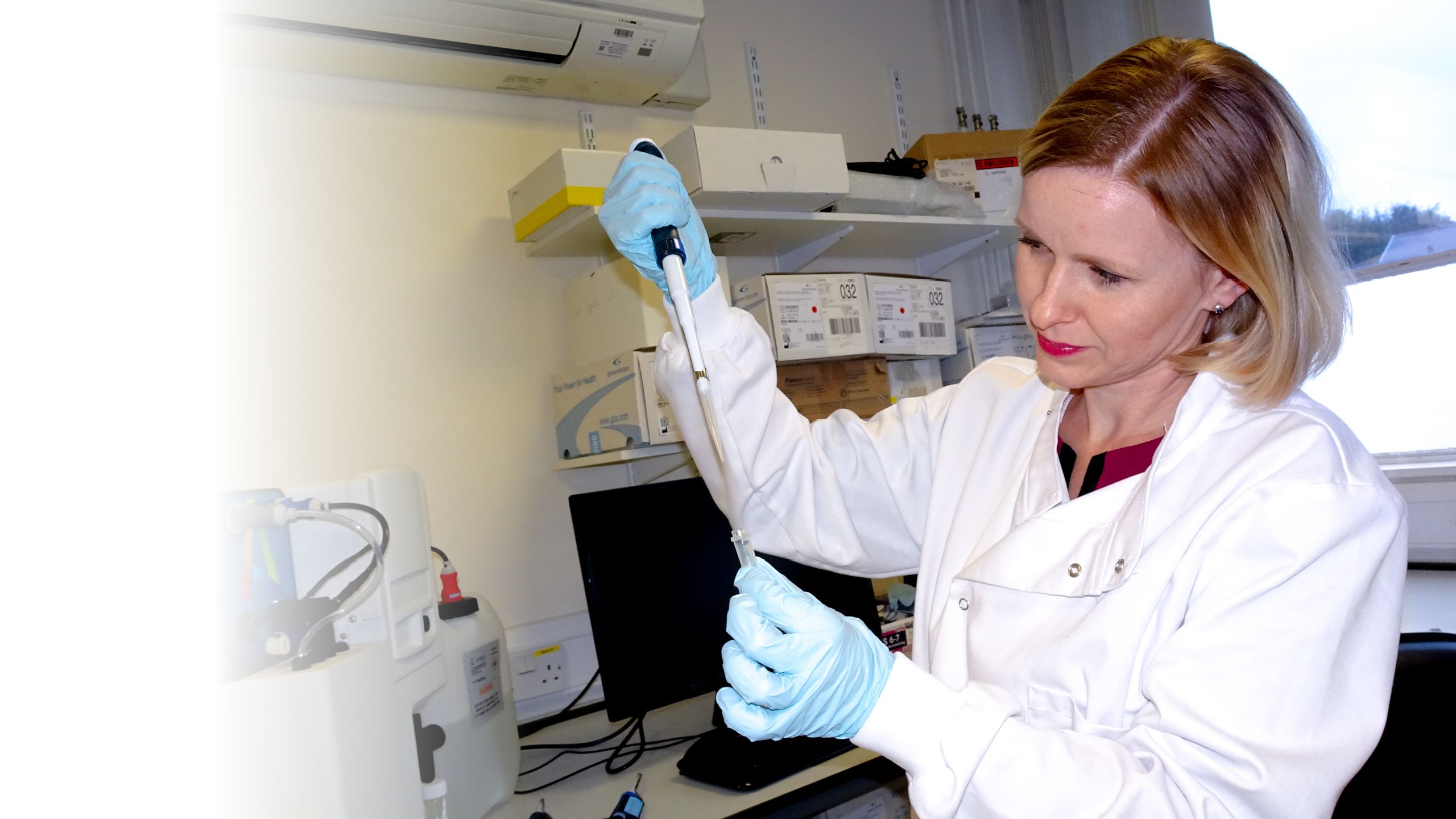 Magda using a pipette in the lab