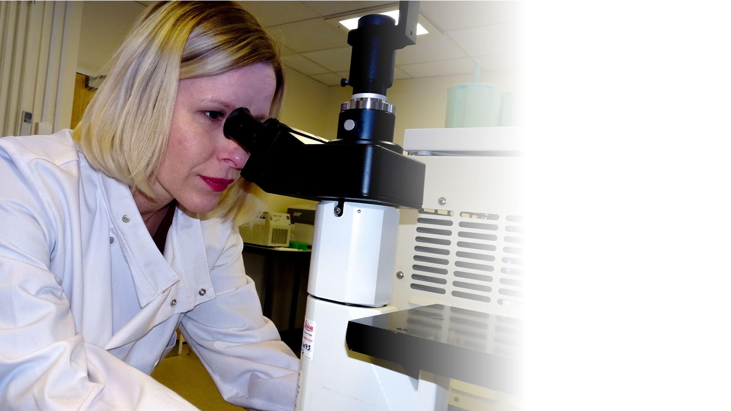 Magda using a microscope